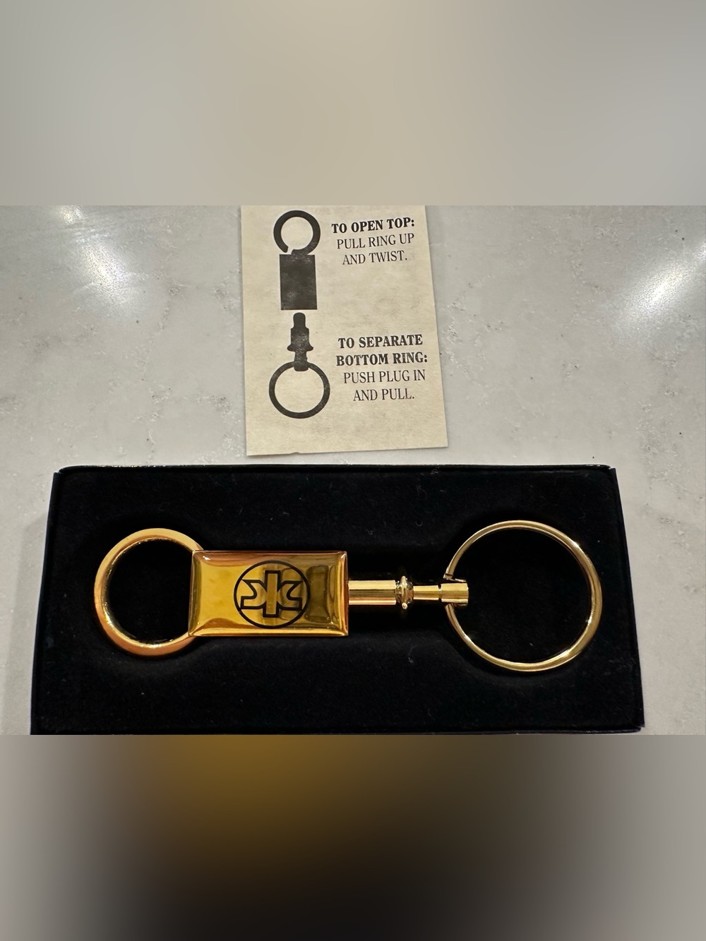 NEW Keyring - Kimberly-Clark logo (Brass)